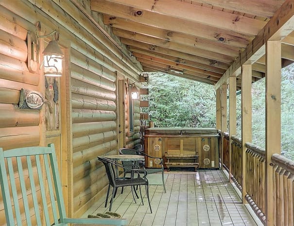 Front porch and hot tub in scenic High Hopes Cabin rental in Maggie Valley, NC